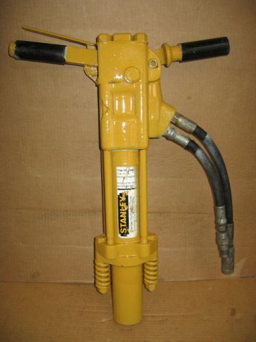 TT46 Tie Tamper Railroad Tool by Stanley Hydraulic, equipped with a pair of attachments.