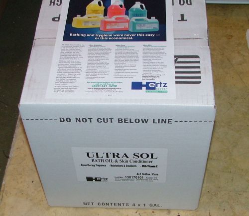 A case containing (4) 1-gallon bottles of Hertz Ultra Sol Bath Oil & Conditioner, sealed.