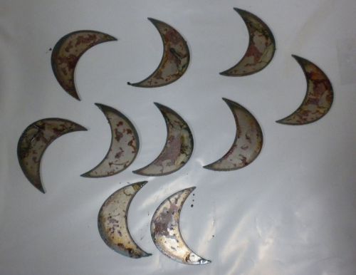 A set of ten vintage craft stencil ornament magnets, each with a crescent moon design, measuring 1.5 inches and made of rustic metal.