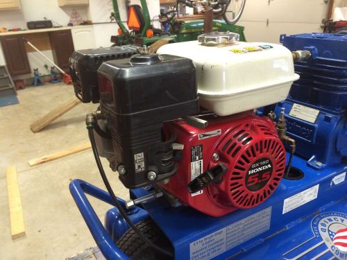 Portable gas air compressor made by Quincy.