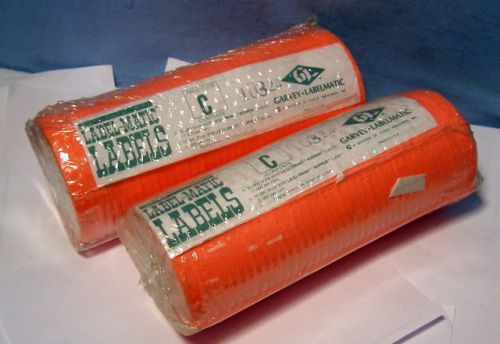 * two (2) rolls - florescent orange - garvey labelmatic labels w ink - 20,000 for sale